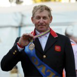 happy man in suit with the medal